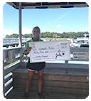 Young woman holding a giant check