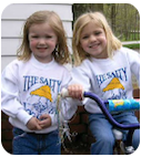 Two dogs in saltydog t-shirts.
